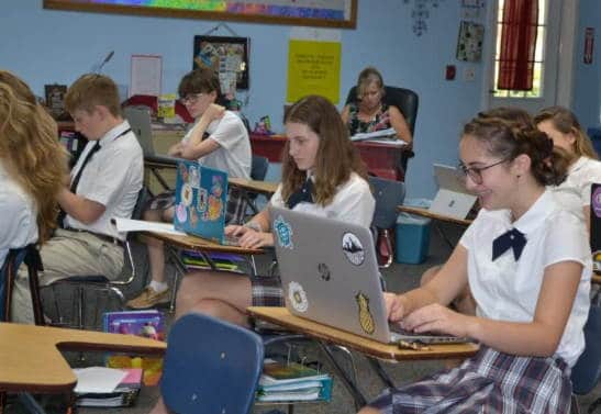 Middle School students working at their desks in the classroom