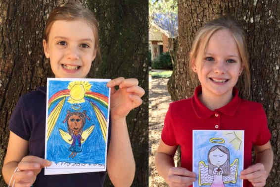 Two students displaying Angels of Allison card creations