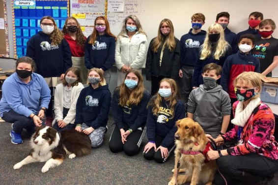 Group of students, volunteers from Humane Society and two dogs