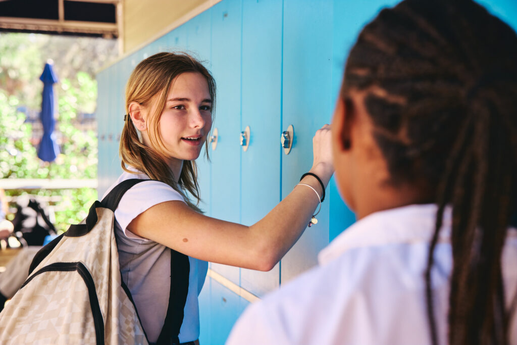 Middle schooler standing at lockers