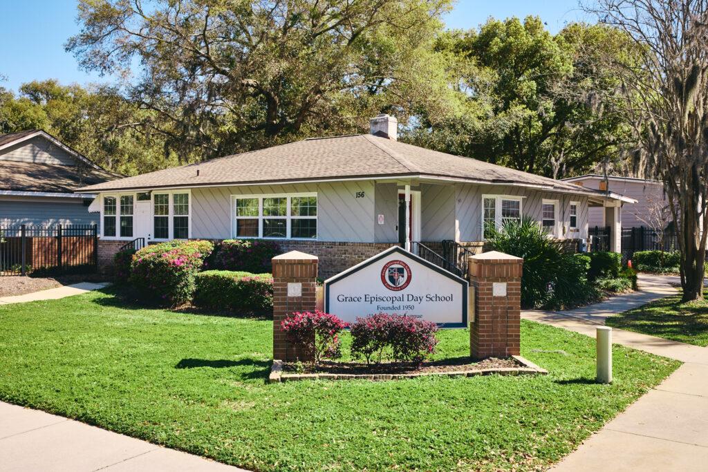 Front entrance of Grace Episcopal Day School with school sign